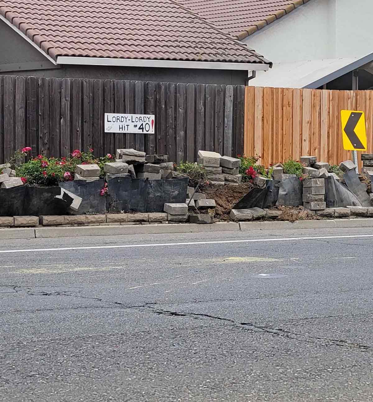 Someone puts a sign up every time someone crashes into this planter