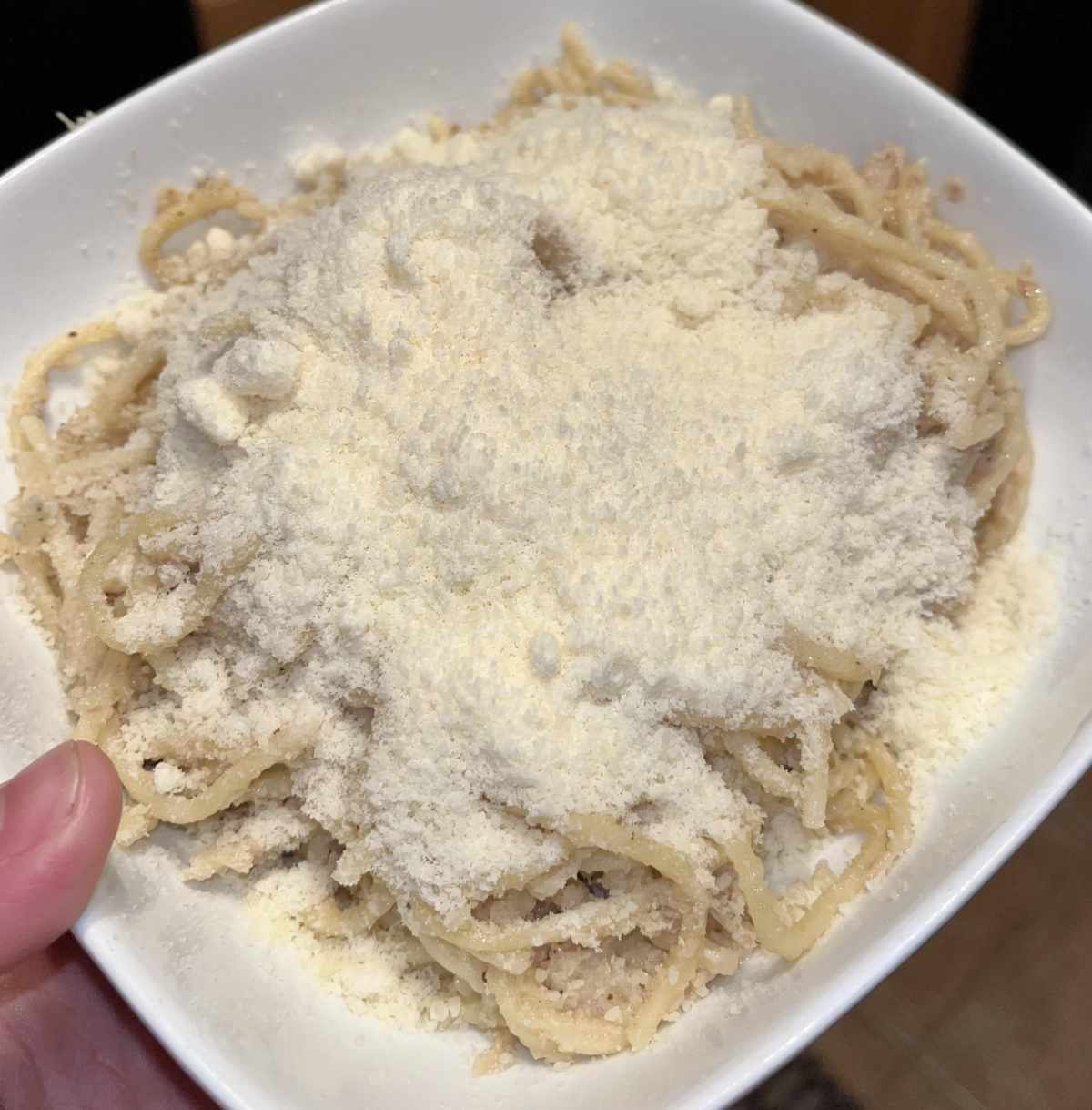 The amount of Parmesan my husband puts on his pasta