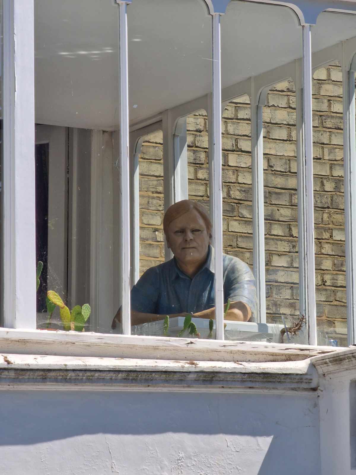 There's a house in my neighborhood with a super creepy wax man sat in a 1st floor sun room