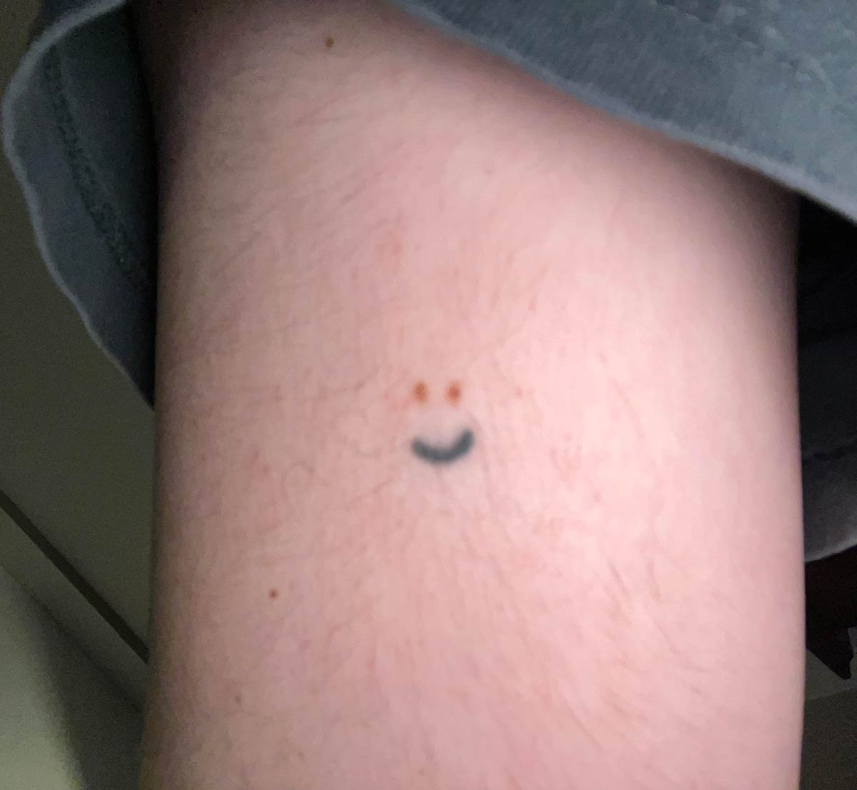 I have two freckles next to each other so I got a smile tattoo
