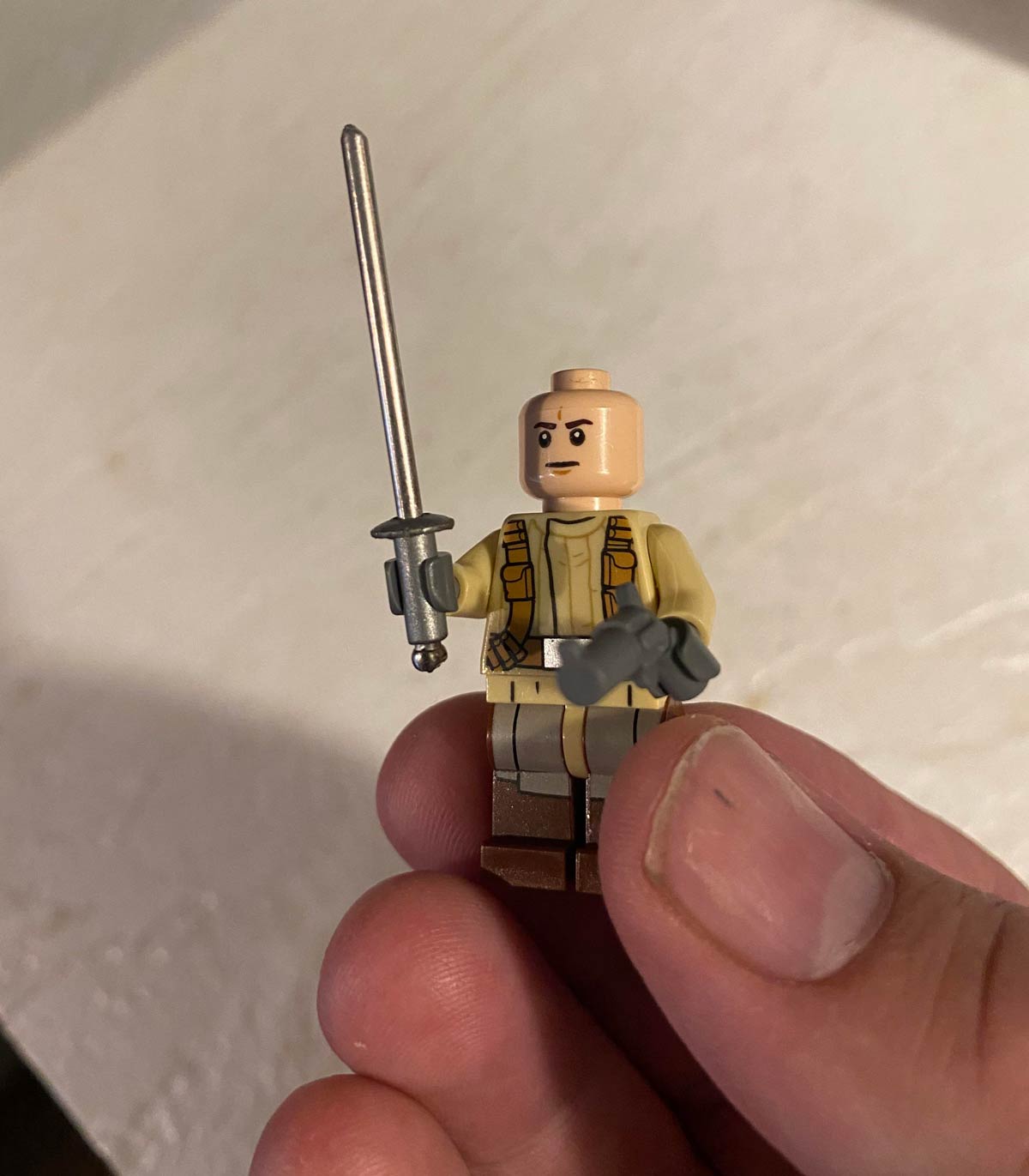 Piece of a broken bicycle spoke I found on the ground works perfectly as a Lego sword
