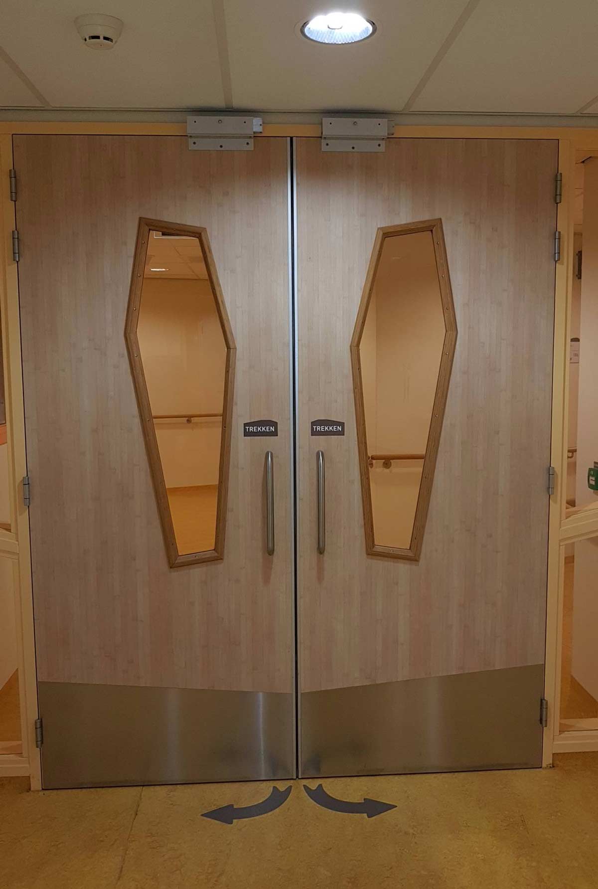 These coffin-shaped door windows at a hospital