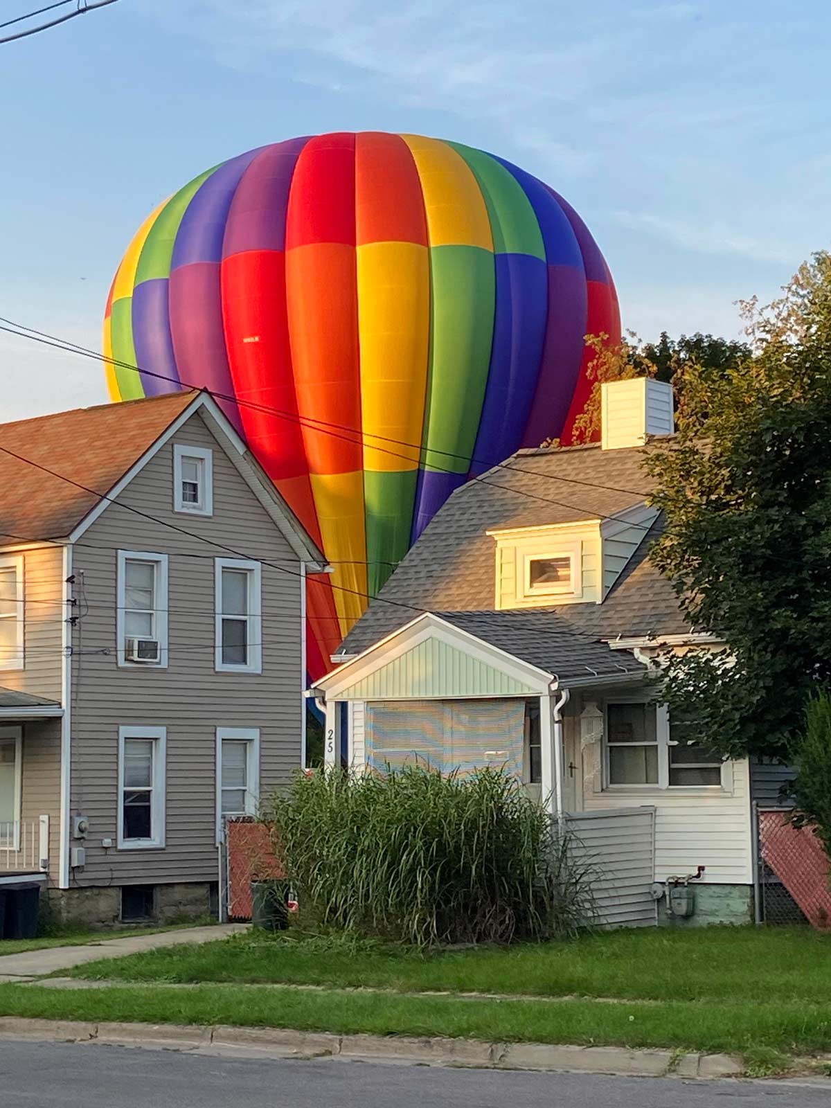 A hot air balloon landed in my backyard while I was out. The neighbor snapped this pic