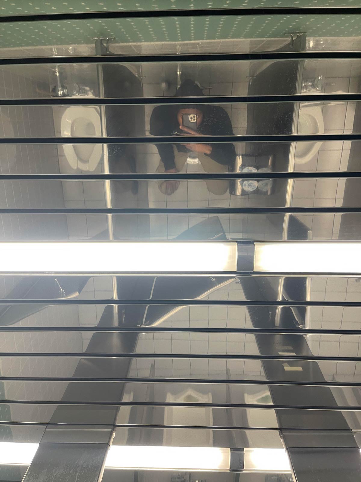 This mirrored ceiling in our bathroom at work