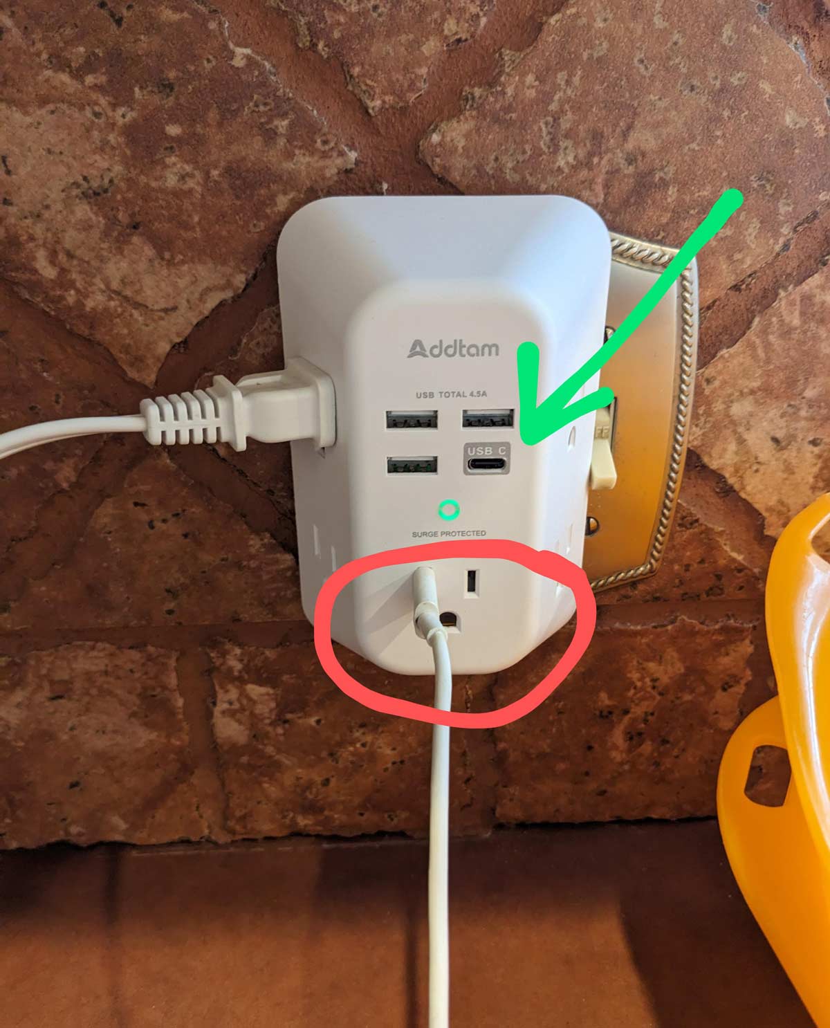 My wife was wondering why the phone was not being charged (Green usb-c connection, Red - Outlet)