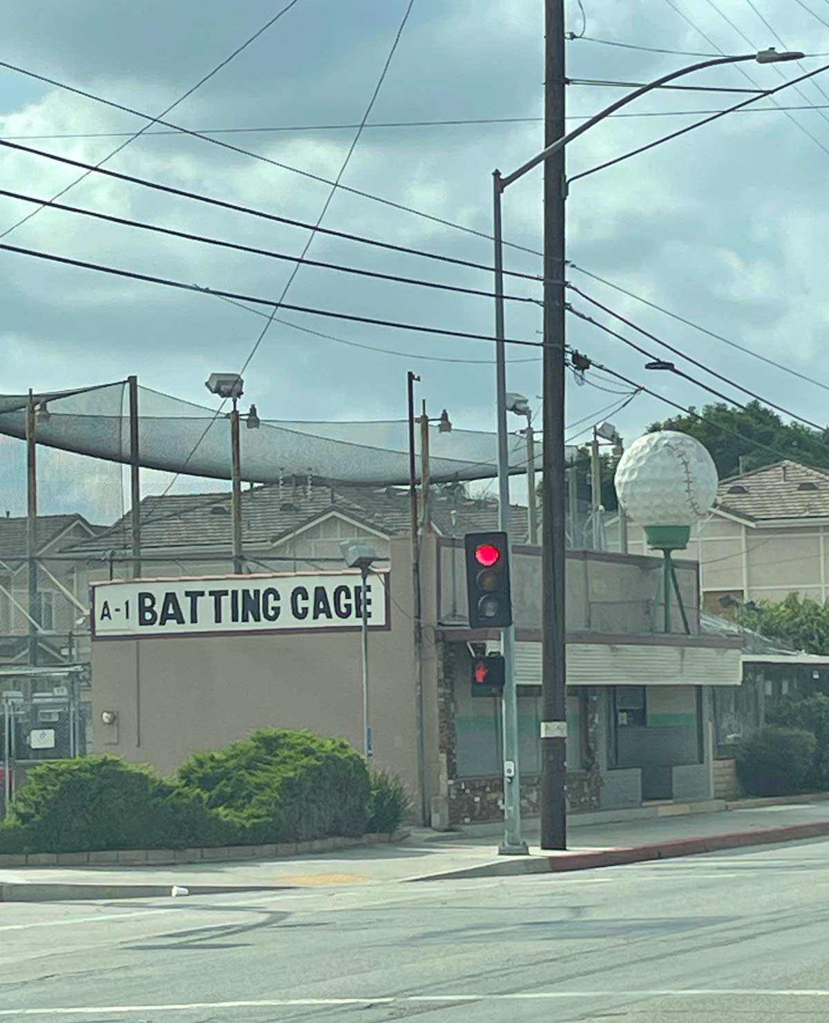 These batting cages used to be a driving range. Instead of replacing the golf ball they just added stitches to it instead
