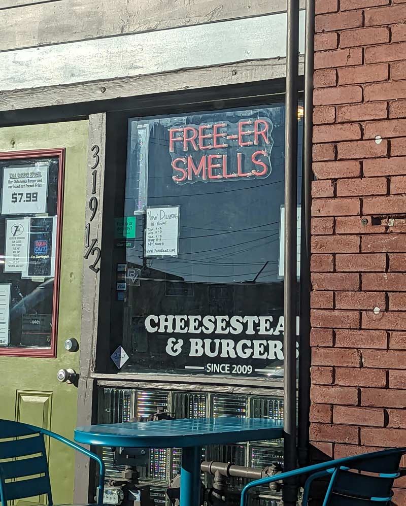 This local restaurant across from a Jimmy John's has a "free-er smells" sign