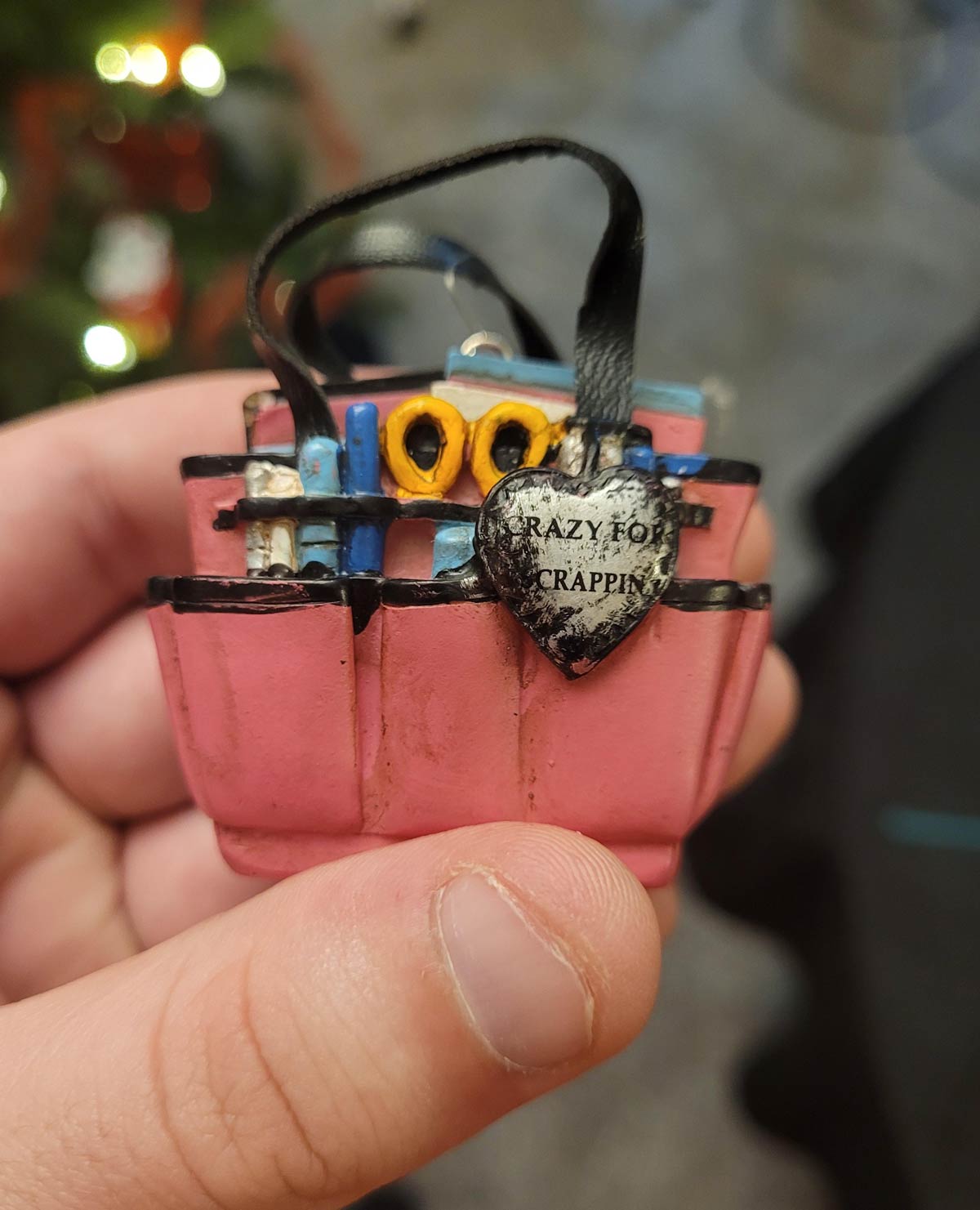 My family started putting up our Christmas tree. This ornament that we've had for years is meant to say "Crazy for Scrappin'". Weirdly, it still works for one of us
