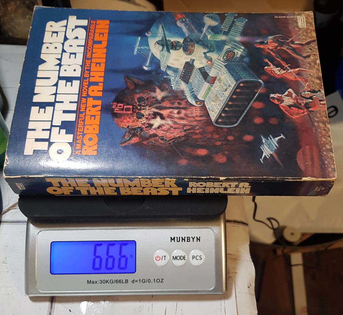 The weight, in grams, of this Robert A. Heinlein book