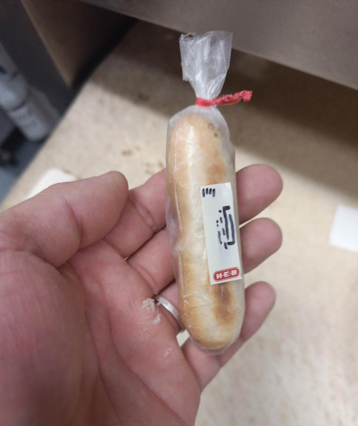 My husband works in the HEB bakery and today he made this tiny baguette