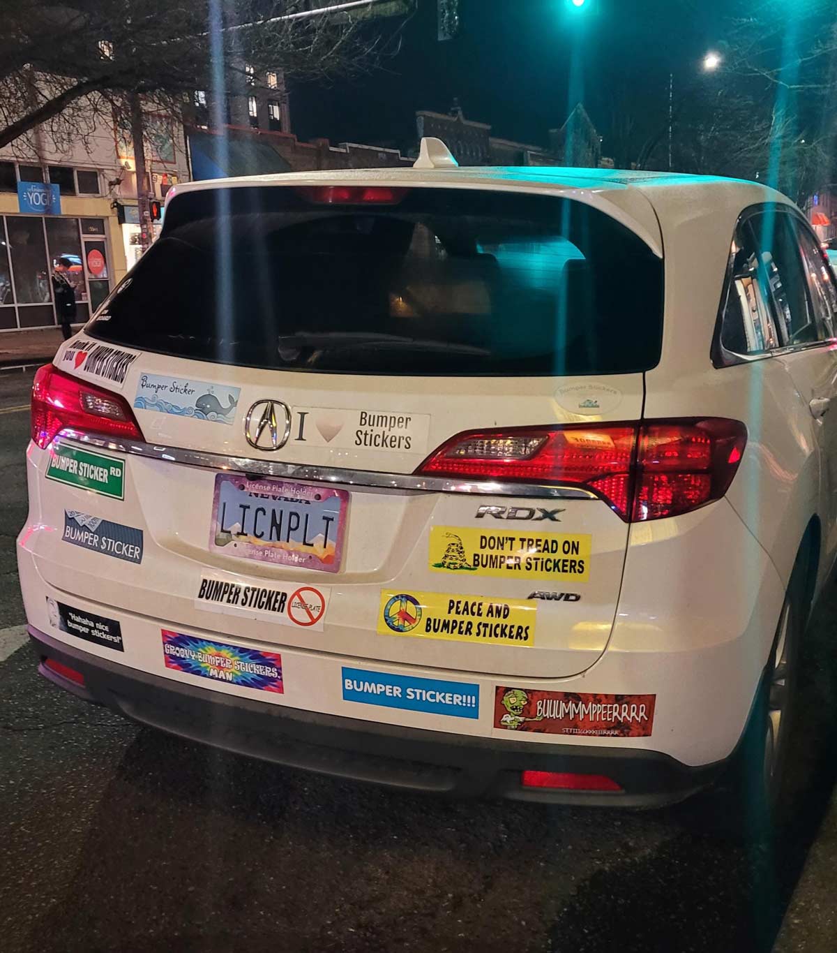 A car with bumper stickers