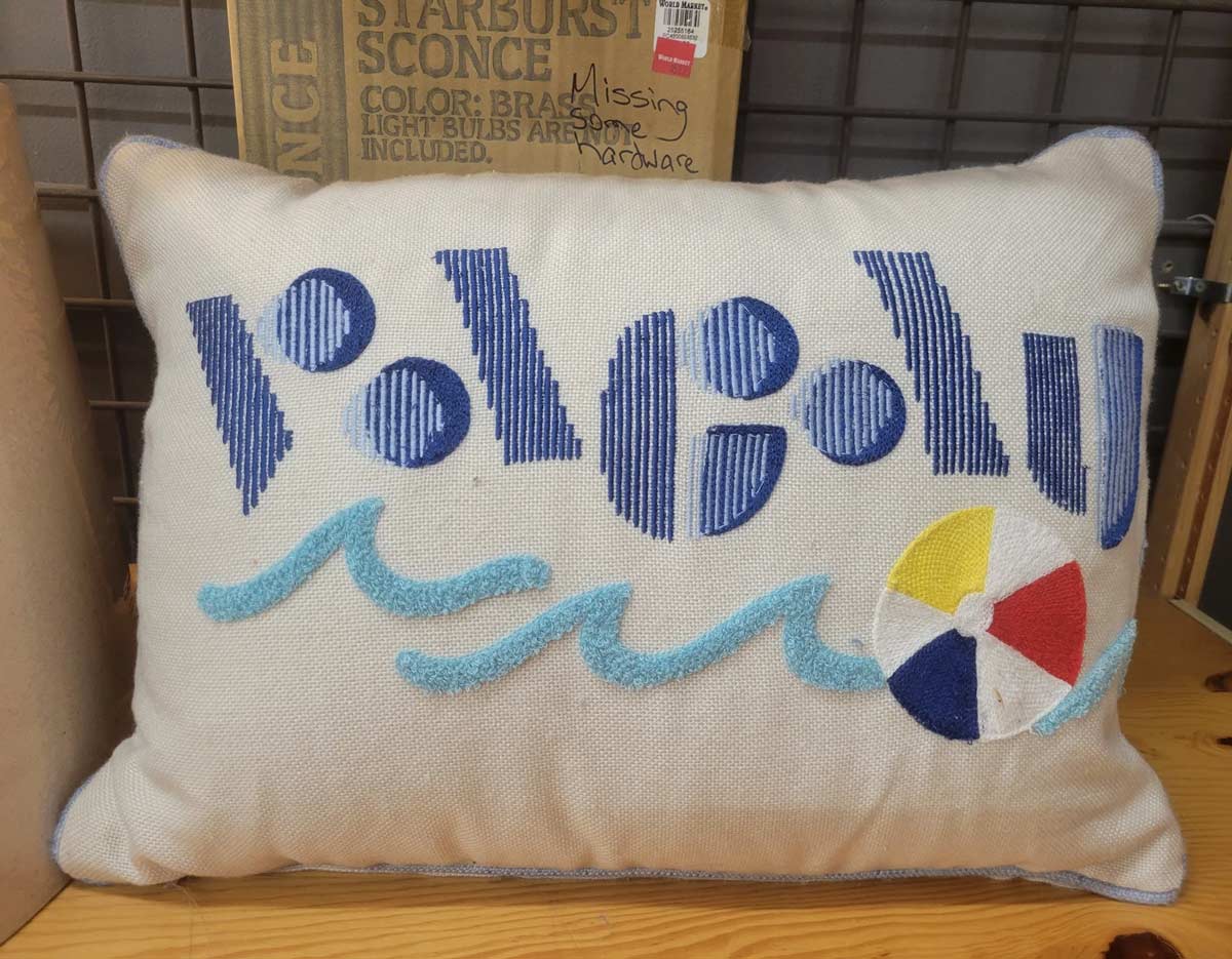 Can you make out the word on this pillow?