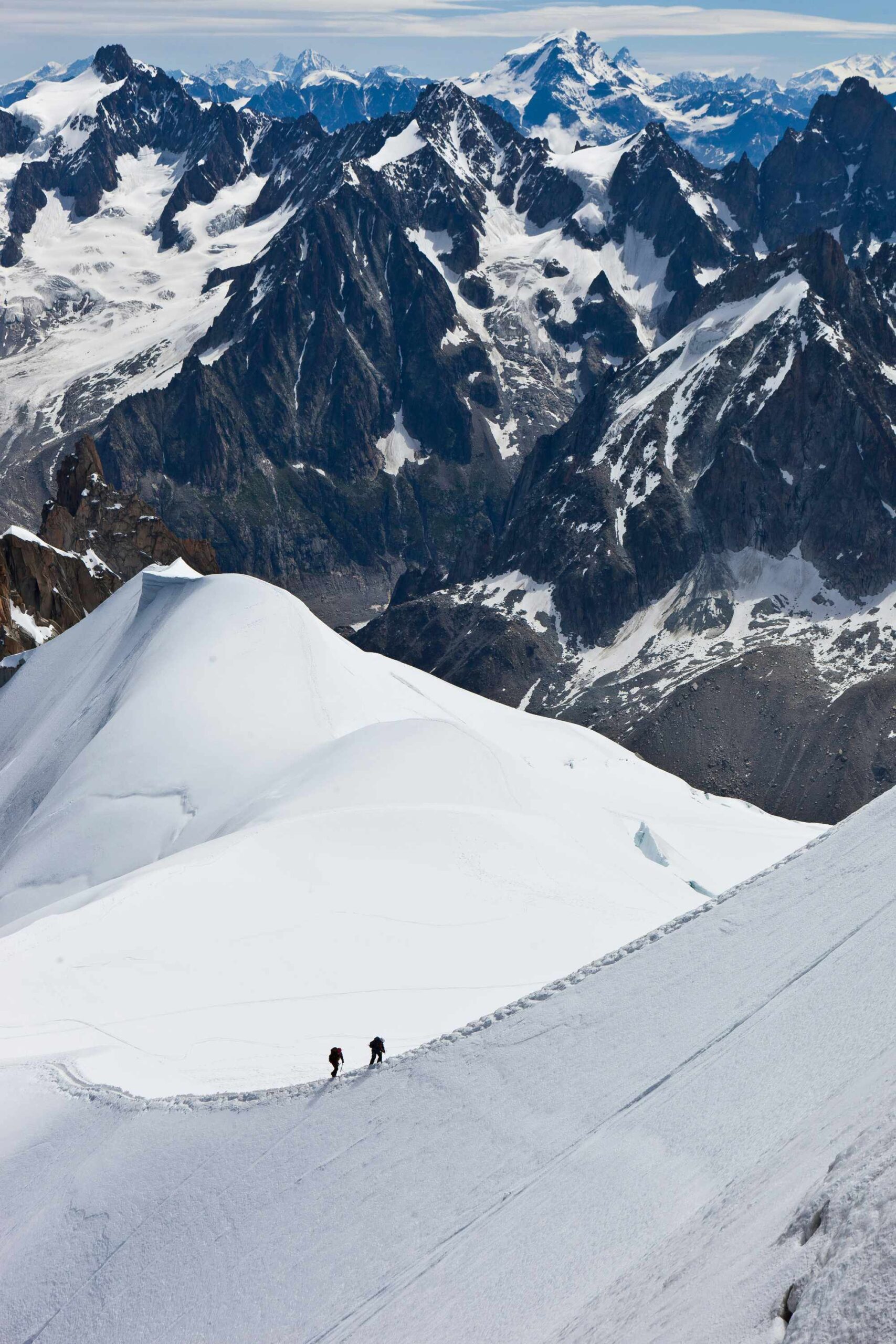 Hard climb on a crest, heading to Mont Blanc, Chamonix, France