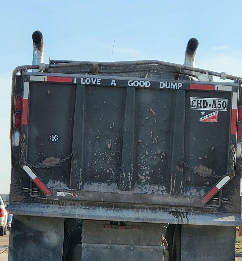 Seen on the back of a dump truck in traffic