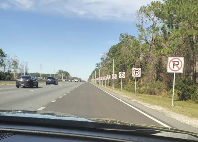 An overabundance of No Parking signs near a rest area in Florida