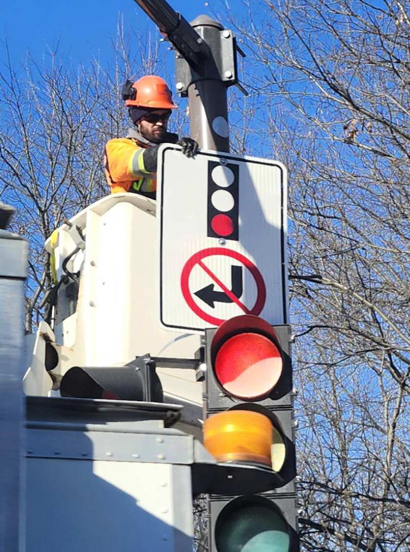 Snapped a pic of this guy installing a sign upside down
