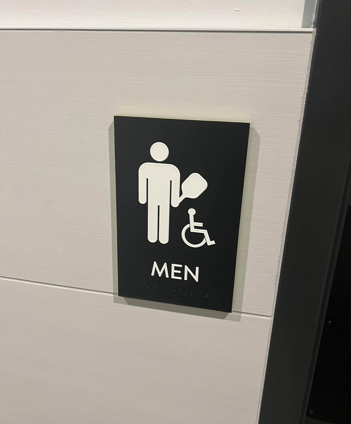 Restroom sign at pickleball courts