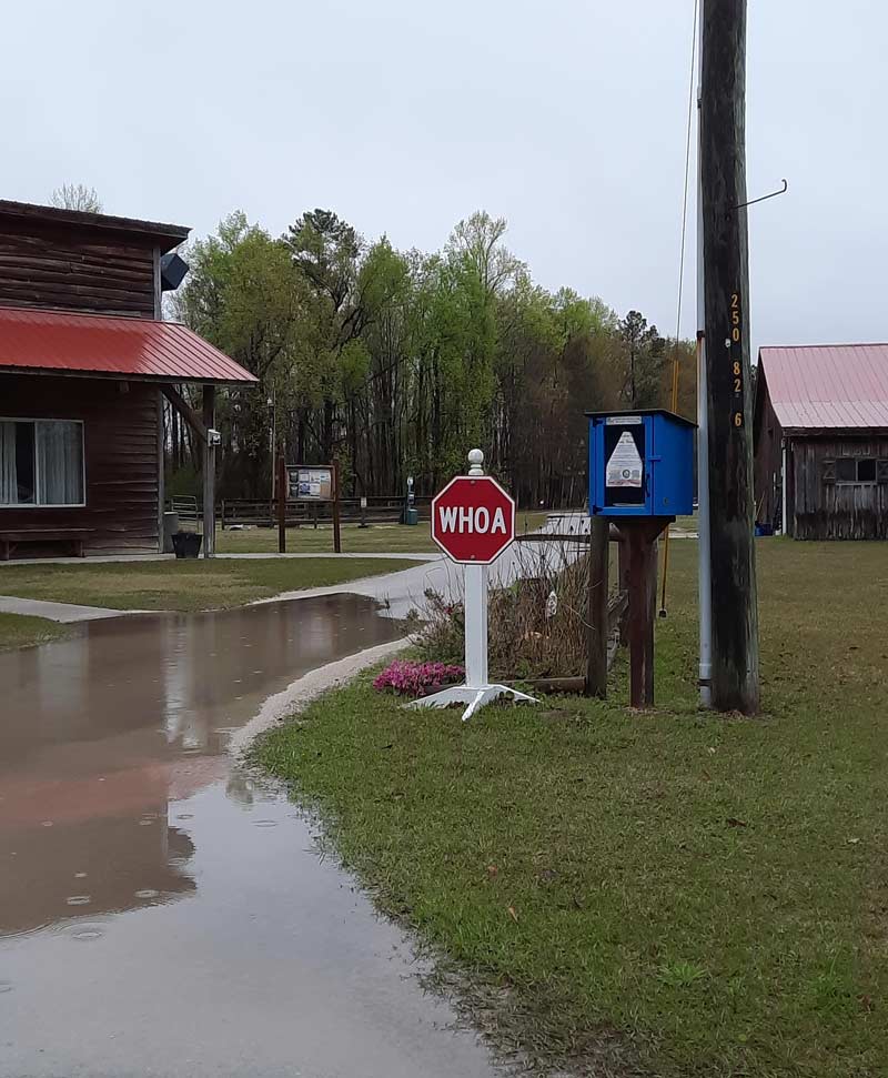 This farm has a stop sign for horses