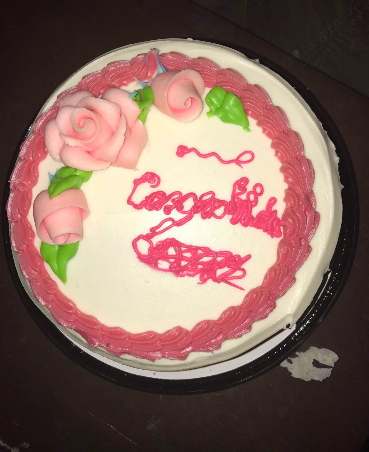 It was supposed to say “Congratulations”. The person who normally writes on cakes wasn’t around, so another person in the bakery offered to do it. This is what I got