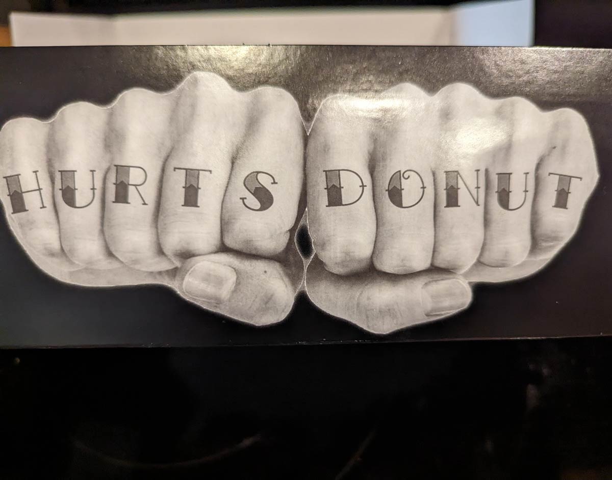 This donut box has extra fingers