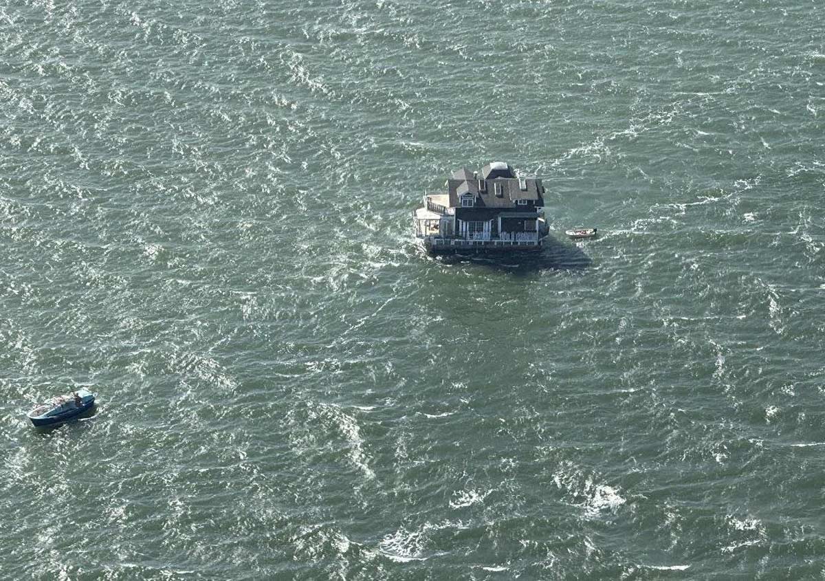 Someone towing a house in the San Francisco Bay today