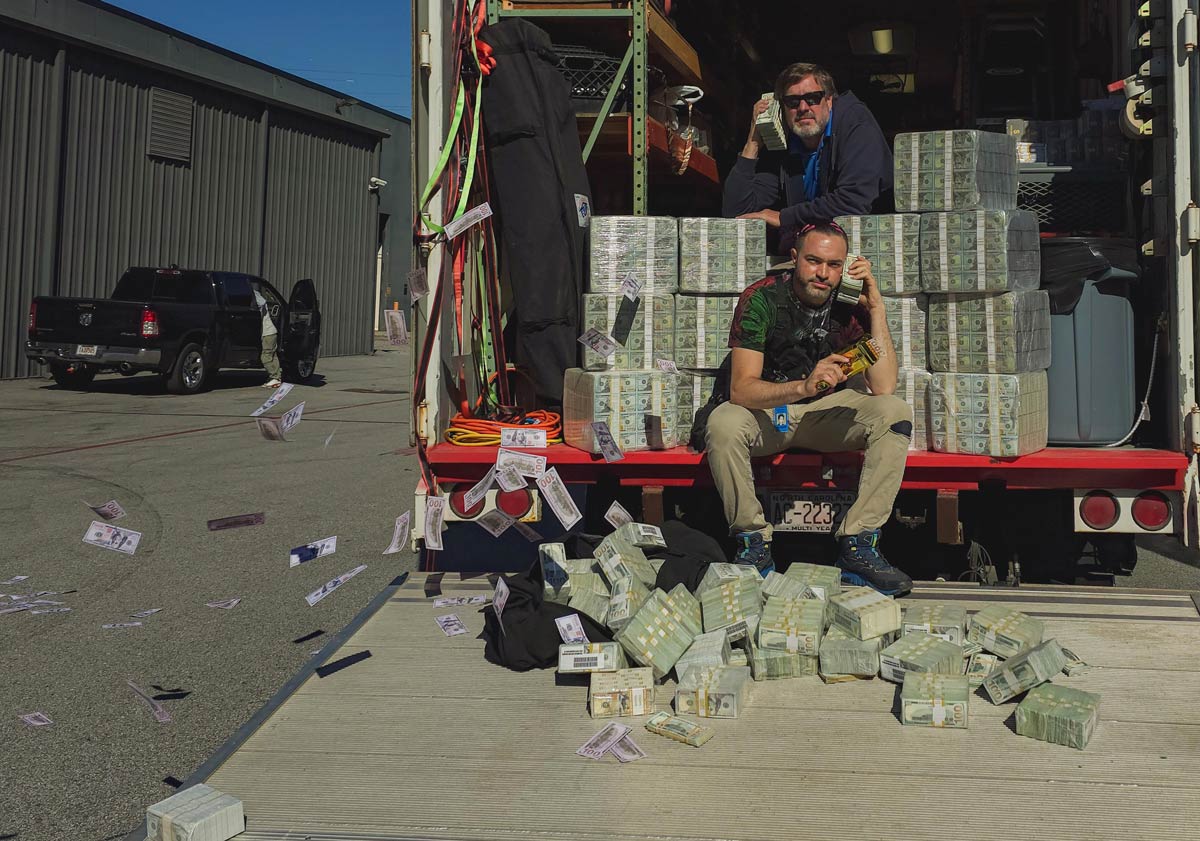 I asked my boss if we could pose with (some) of our prop money at the end of the day; he insisted we use ALL of it