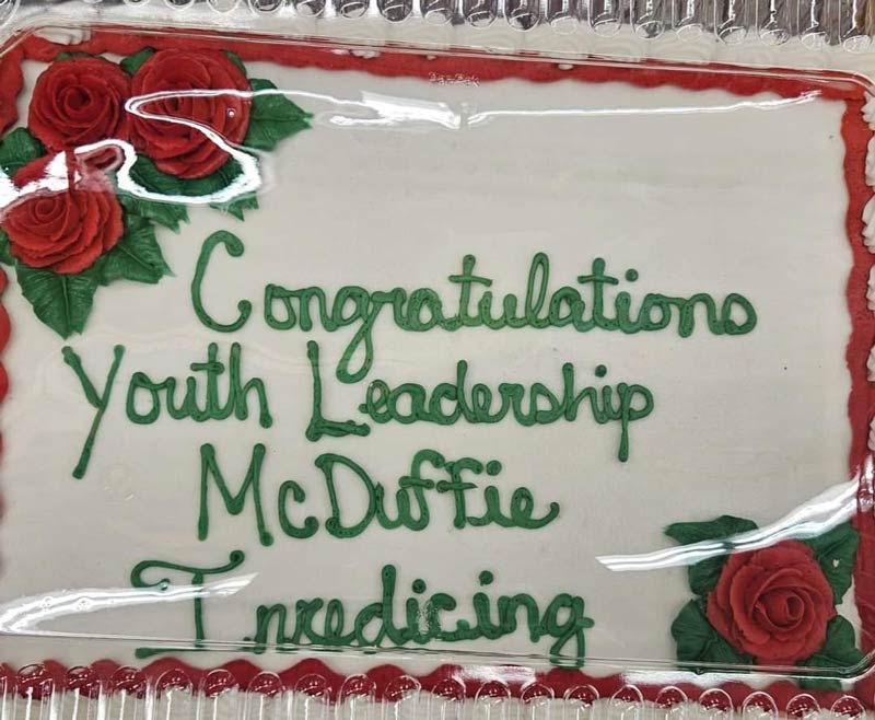 The instructions were to write "Congratulations Youth Leadership McDuffie" in red icing on the cake