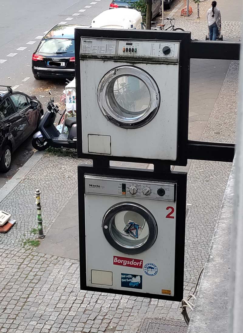My local laundromat uses washing machine fronts for a sign