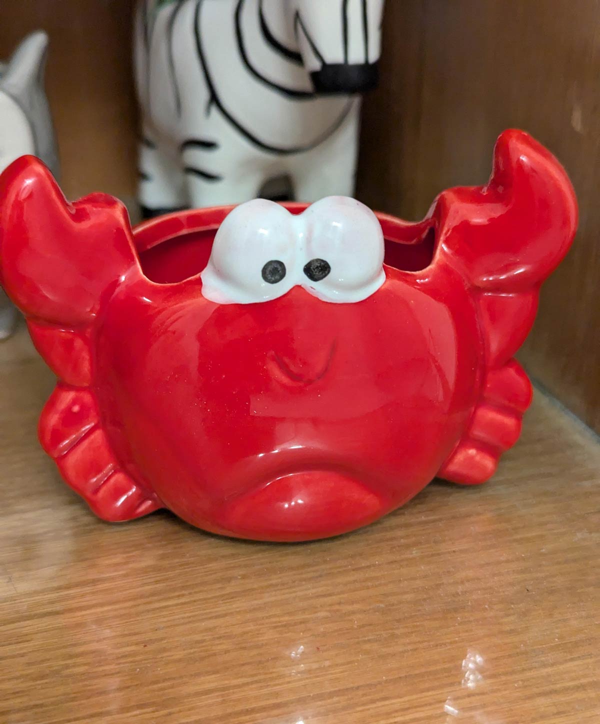 Wife says the crab is happy, I see the crab as sad