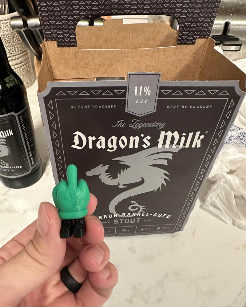 Found a 3D printed middle finger with legs in my 4 pack of beer