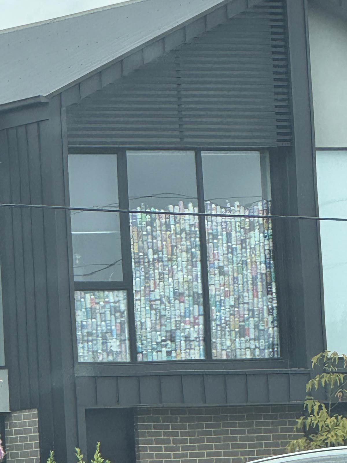 This house I drove past has a beer can collection