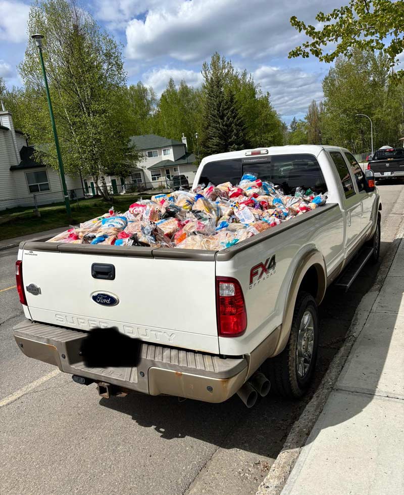 Someone in my city is driving around with a pickup truck full of bread