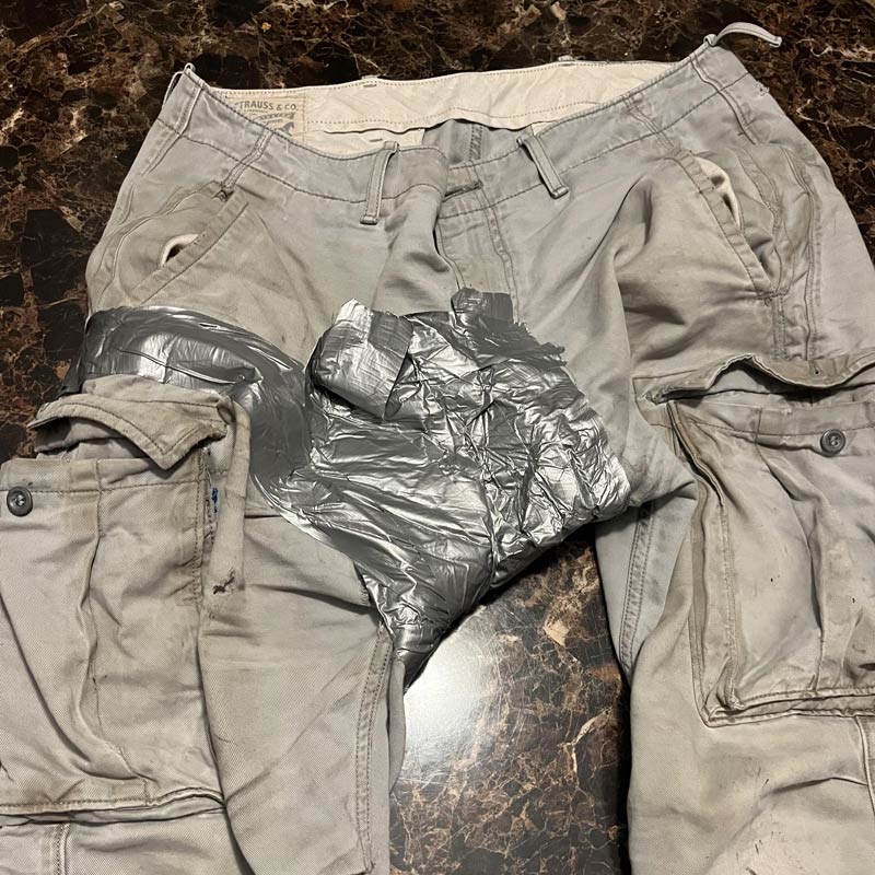 The condition my husbands pants need to be in before he lets me throw them away